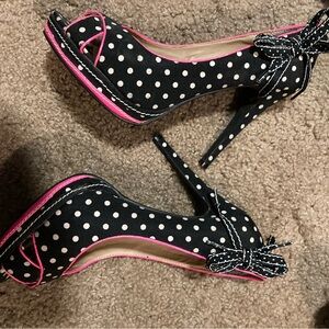 Not Rated black with white polka dots and pink trim. Never worn.